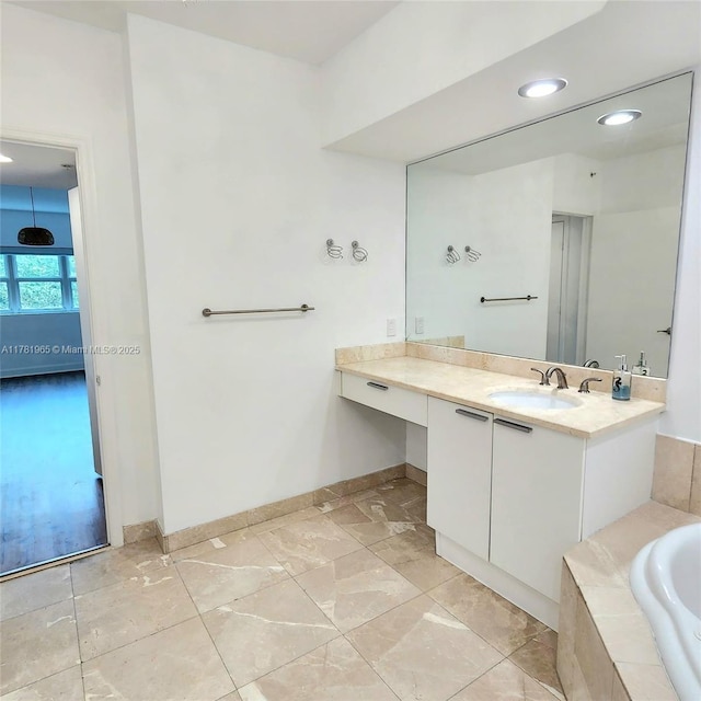 14951 Royal Oaks Ln Unit 203, North Miami, FL 33181 - bathroom featuring recessed lighting, vanity, baseboards, and a garden tub