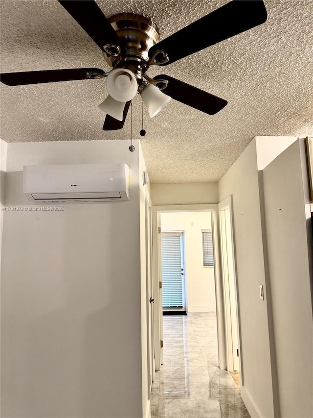 900 Atlantic Shores Blvd Unit 126, Hallandale Beach, FL 33009 - detailed view of a wall mounted AC, a textured ceiling, ceiling fan, and baseboards