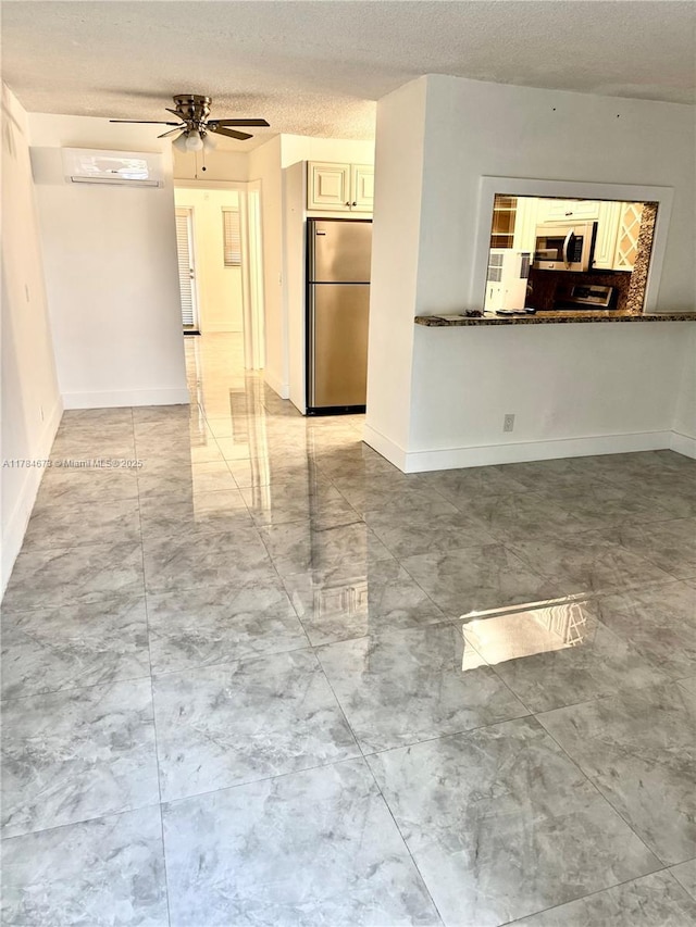 900 Atlantic Shores Blvd Unit 126, Hallandale Beach, FL 33009 - empty room with ceiling fan, a textured ceiling, light marble finish floors, and baseboards