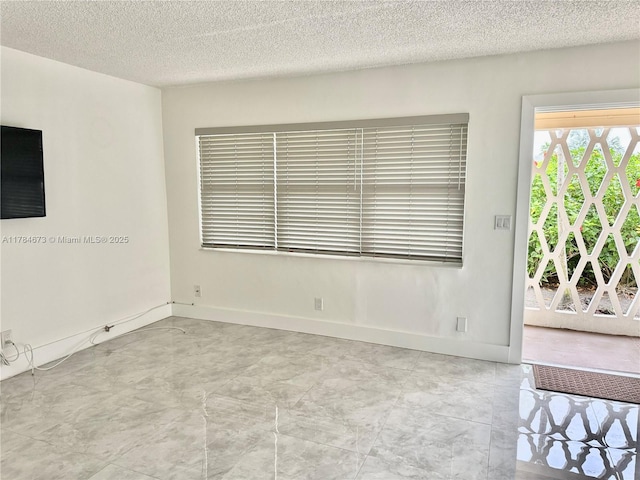 900 Atlantic Shores Blvd Unit 126, Hallandale Beach, FL 33009 - unfurnished room featuring a textured ceiling and baseboards