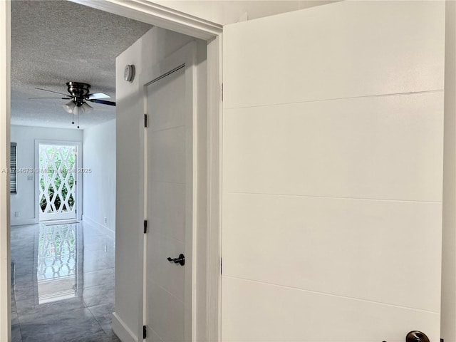 900 Atlantic Shores Blvd Unit 126, Hallandale Beach, FL 33009 - hall featuring a textured ceiling and baseboards