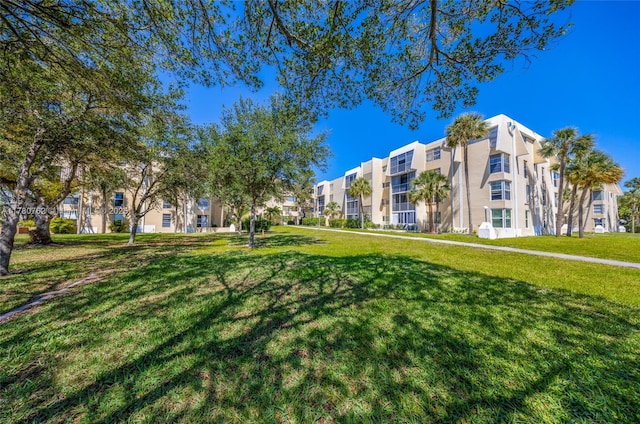 view of community featuring a yard