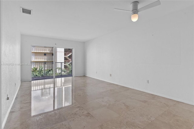 677 NE 24th St Unit 504, Miami, FL 33137 - spare room with a ceiling fan and baseboards