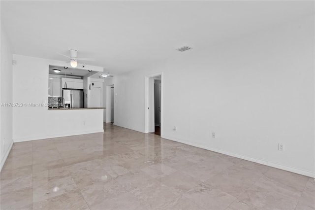 677 NE 24th St Unit 504, Miami, FL 33137 - unfurnished living room with ceiling fan and light marble finish flooring