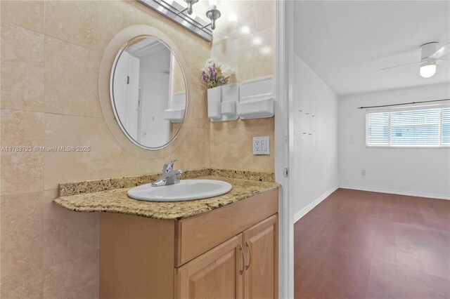 677 NE 24th St Unit 504, Miami, FL 33137 - bathroom featuring vanity, wood finished floors, and ceiling fan