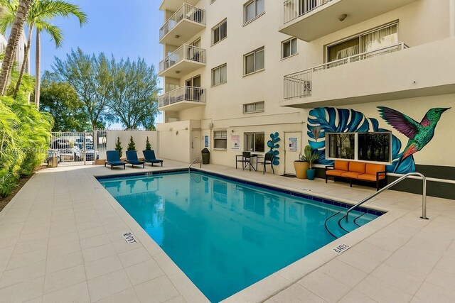 677 NE 24th St Unit 504, Miami, FL 33137 - community pool featuring a patio area