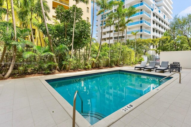 677 NE 24th St Unit 504, Miami, FL 33137 - community pool with a patio area