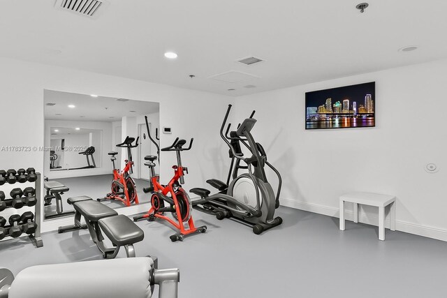 677 NE 24th St Unit 504, Miami, FL 33137 - exercise room featuring baseboards and recessed lighting