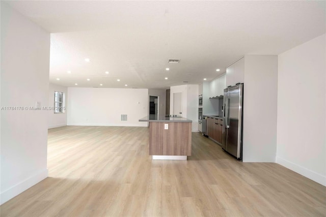 13912 SW 103rd Ln, Miami, FL 33186 - kitchen with stainless steel fridge, recessed lighting, open floor plan, visible vents, and light wood finished floors
