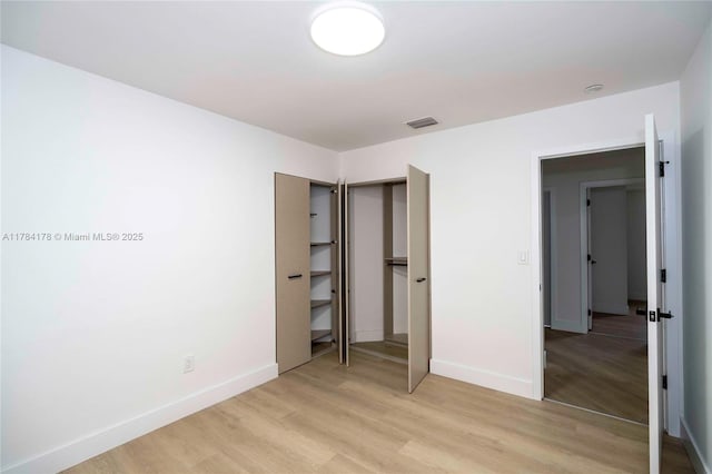 13912 SW 103rd Ln, Miami, FL 33186 - unfurnished bedroom featuring light wood-style floors, visible vents, and baseboards