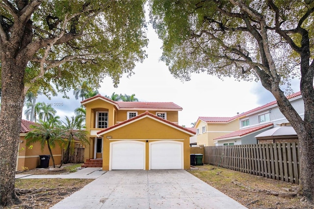 13912 SW 103rd Ln, Miami, FL 33186 - view of front of home featuring a tiled roof, a garage, stucco siding, fence, and driveway