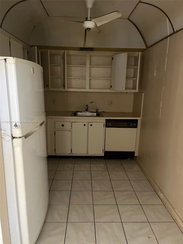 kitchen featuring open shelves, light tile patterned flooring, a sink, and white appliances