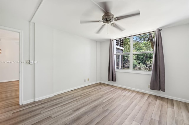 101 Royal Park Dr Unit 1D, Oakland Park, FL 33309 - empty room with ceiling fan, wood finished floors, and baseboards