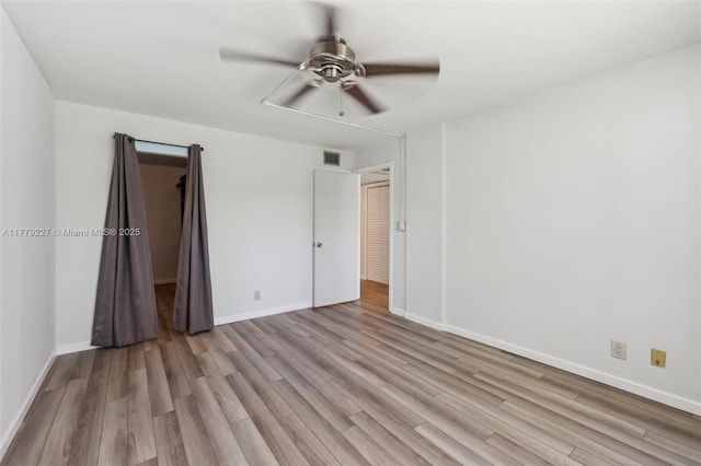 101 Royal Park Dr Unit 1D, Oakland Park, FL 33309 - unfurnished bedroom with ceiling fan, light wood finished floors, and baseboards