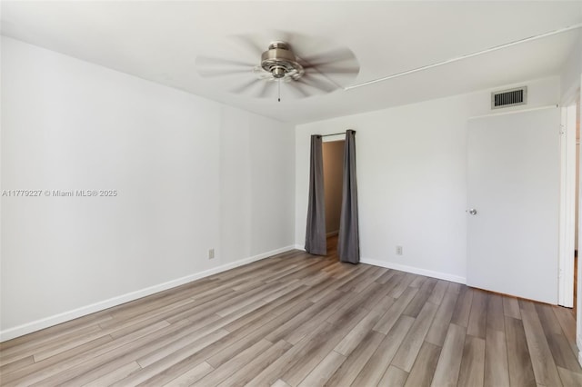 101 Royal Park Dr Unit 1D, Oakland Park, FL 33309 - spare room with visible vents, light wood-type flooring, a ceiling fan, and baseboards