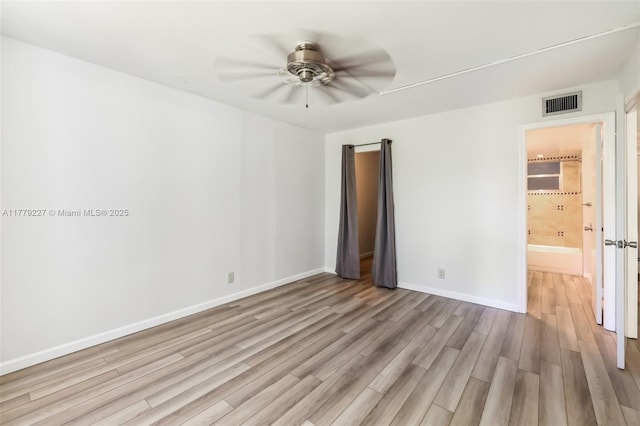 101 Royal Park Dr Unit 1D, Oakland Park, FL 33309 - spare room with visible vents, ceiling fan, light wood-style floors, and baseboards