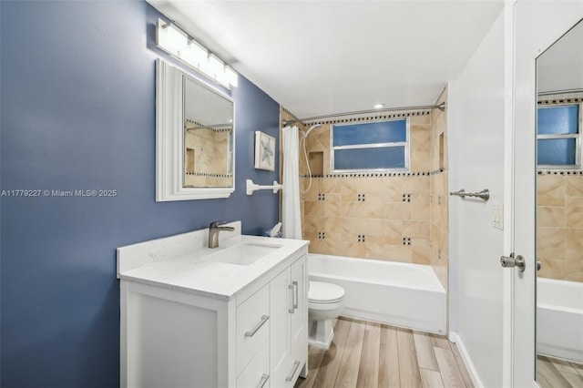 101 Royal Park Dr Unit 1D, Oakland Park, FL 33309 - bathroom with shower / bath combo, toilet, vanity, and wood finished floors