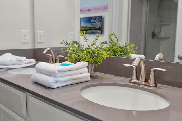 690 Drop, Shot, FL 33896 - bathroom featuring a sink, double vanity, and a shower with door