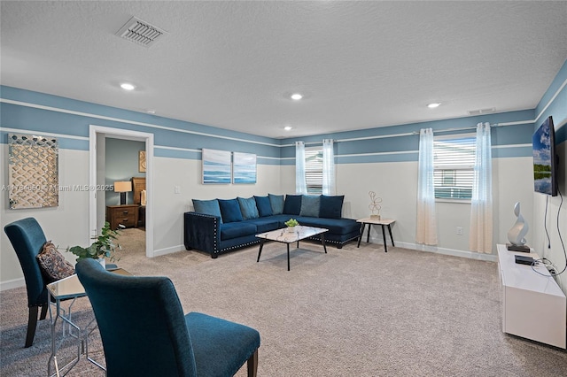 690 Drop, Shot, FL 33896 - living area featuring a textured ceiling, baseboards, carpet, and visible vents