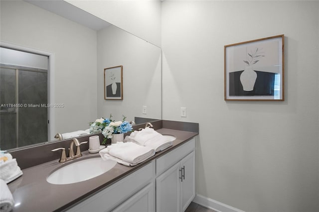 690 Drop, Shot, FL 33896 - bathroom with double vanity, a sink, and baseboards