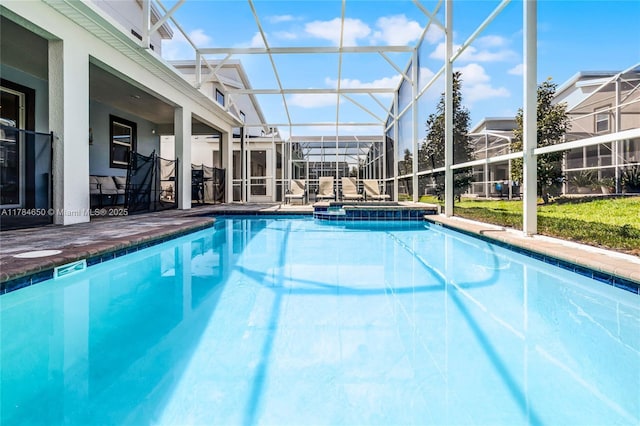 690 Drop, Shot, FL 33896 - view of pool with a patio area, glass enclosure, and a pool with connected hot tub