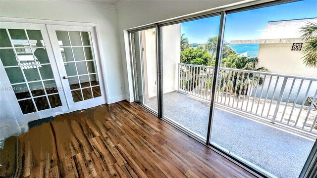 300 Bayview Dr Unit 206, Sunny Isles Beach, FL 33160 - unfurnished sunroom featuring french doors