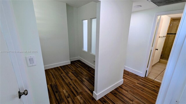 300 Bayview Dr Unit 206, Sunny Isles Beach, FL 33160 - corridor featuring dark wood-style floors and baseboards