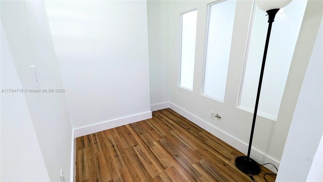 300 Bayview Dr Unit 206, Sunny Isles Beach, FL 33160 - empty room featuring wood finished floors and baseboards