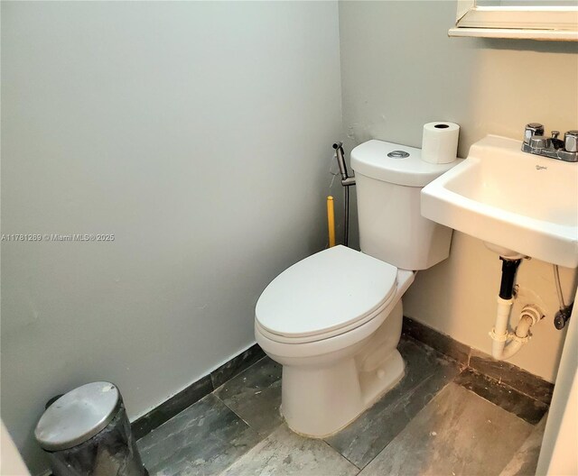 16750 NE 10th Ave Unit 326, North Miami Beach, FL 33162 - spare room with wood finished floors, baseboards, and a textured ceiling