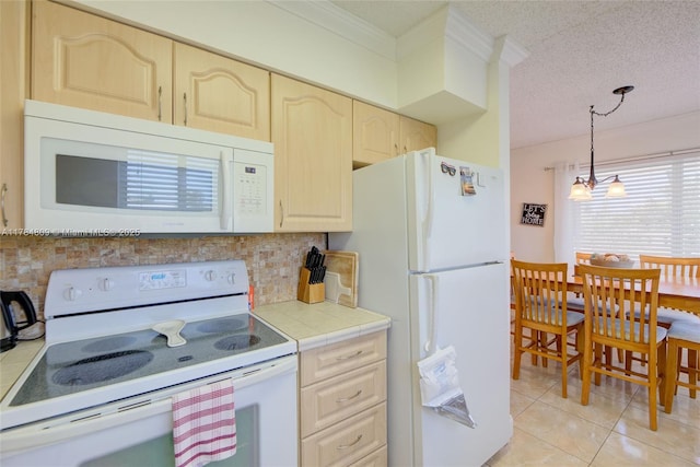 920 SW 10th Ter Unit 12Ar, Hallandale Beach, FL 33009 - kitchen with tile countertops, white appliances, light tile patterned flooring, tasteful backsplash, and a textured ceiling
