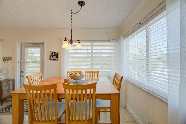 920 SW 10th Ter Unit 12Ar, Hallandale Beach, FL 33009 - dining space featuring a textured ceiling, a wealth of natural light, and light tile patterned floors