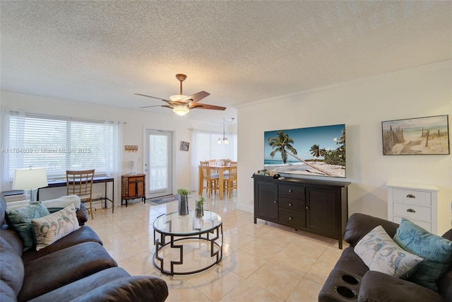 920 SW 10th Ter Unit 12Ar, Hallandale Beach, FL 33009 - living room with light tile patterned flooring, a textured ceiling, ceiling fan, and a healthy amount of sunlight