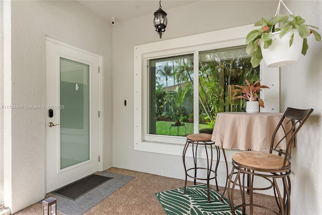 property entrance featuring stucco siding