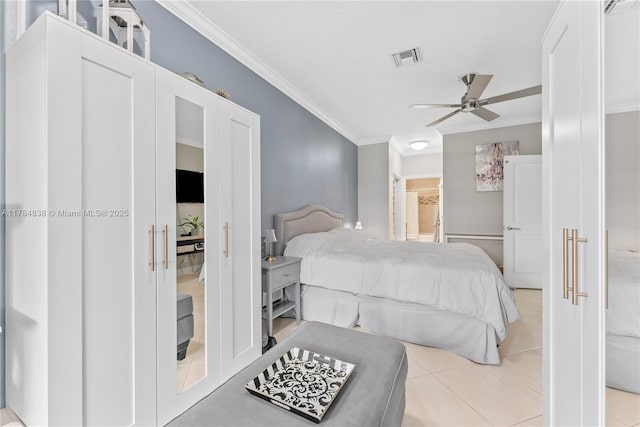 bedroom featuring crown molding, connected bathroom, a ceiling fan, visible vents, and light tile patterned flooring
