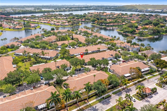 bird's eye view with a residential view and a water view