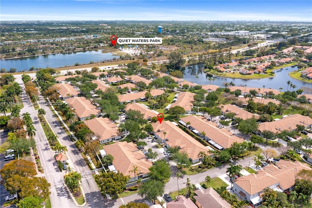 aerial view featuring a residential view and a water view