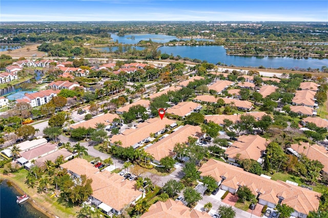aerial view featuring a water view and a residential view