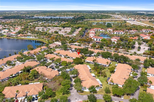 aerial view featuring a residential view and a water view