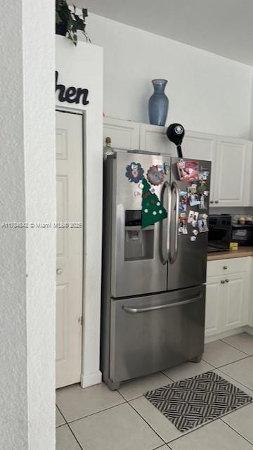 9418 SW 227th Ter, Cutler Bay, FL 33190 - kitchen featuring white cabinetry, light tile patterned floors, and stainless steel fridge with ice dispenser