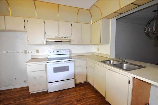 kitchen featuring dark wood-style floors, light countertops, white electric stove, under cabinet range hood, and a sink