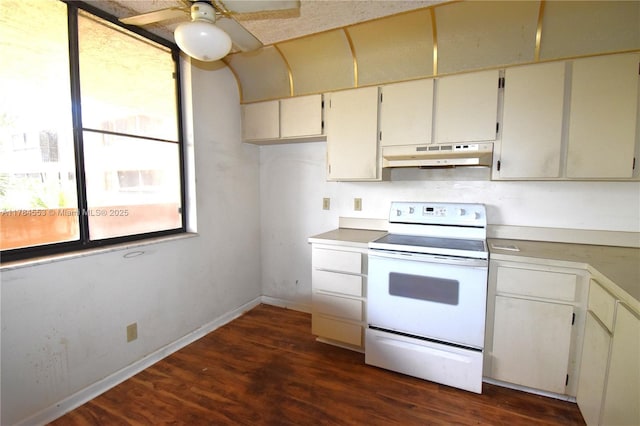 kitchen featuring light countertops, white range with electric cooktop, ceiling fan, under cabinet range hood, and dark wood-type flooring