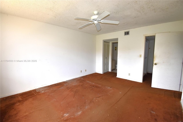 unfurnished bedroom with visible vents, a ceiling fan, and a textured ceiling