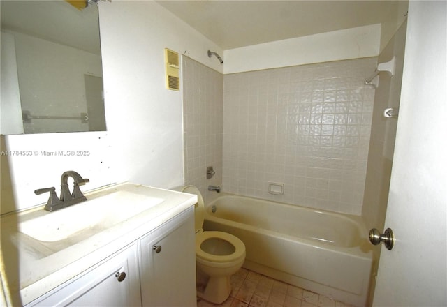 bathroom with visible vents, toilet, vanity, tile patterned floors, and bathing tub / shower combination