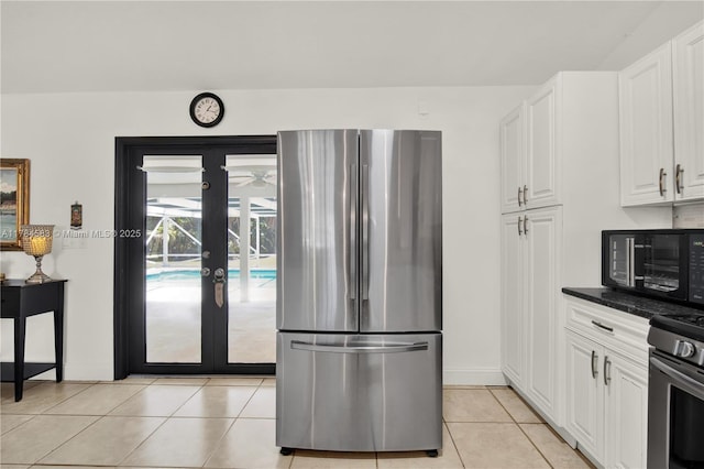 17746 48th Ct N, Loxahatchee, FL 33470 - kitchen with appliances with stainless steel finishes, light tile patterned flooring, white cabinets, and french doors
