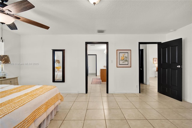 17746 48th Ct N, Loxahatchee, FL 33470 - bedroom with light tile patterned floors, ceiling fan, and a textured ceiling