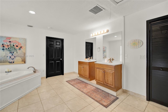 17746 48th Ct N, Loxahatchee, FL 33470 - full bathroom featuring vanity, tile patterned flooring, a garden tub, a closet, and recessed lighting