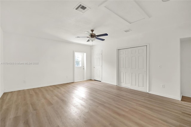 17746 48th Ct N, Loxahatchee, FL 33470 - unfurnished bedroom with light wood-style floors, multiple closets, and ceiling fan