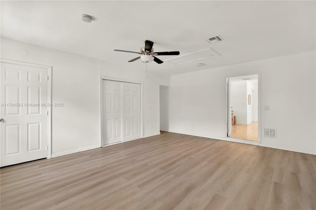 17746 48th Ct N, Loxahatchee, FL 33470 - unfurnished bedroom with light wood-style flooring, ceiling fan, and a closet