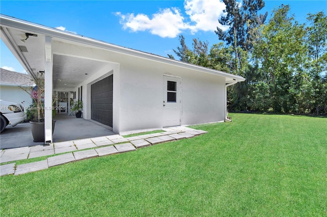 17746 48th Ct N, Loxahatchee, FL 33470 - view of green lawn featuring a garage and a carport