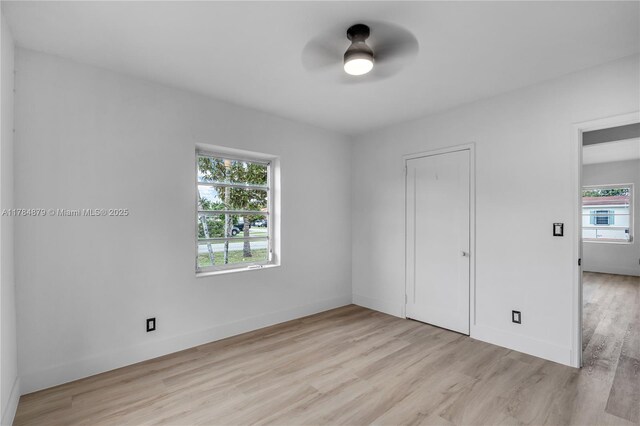 301 E 35th St, Hialeah, FL 33013 - empty room with ceiling fan, light wood-style floors, and baseboards